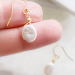 Load image into Gallery viewer, Dainty Coin Pearl Earrings • Delicate Pearl Drops • Oval Coin Pearl Earrings • White Freshwater Pearls • Bridesmaid Gift
