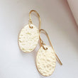 Load image into Gallery viewer, Gold Oval Disk Earrings • Gold Drops • Hammered Disc Drops • Simple Gold Earrings • Minimalist Jewelry • Circle Earrings