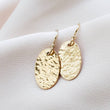 Load image into Gallery viewer, Gold Oval Disk Earrings • Gold Drops • Hammered Disc Drops • Simple Gold Earrings • Minimalist Jewelry • Circle Earrings