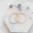 Load image into Gallery viewer, 14k Gold Super Thin Endless Hoops • 22g • Tiny Hoop Earrings • Seamless Hoops • Dainty Earrings • Cartilage • Tragus • Septum • Nose