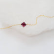 Load image into Gallery viewer, Dainty square cut Garnet bracelet on 14k gold fill cable chain on white background by Studio Blue on Etsy
