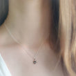 Load image into Gallery viewer, North Star, Starburst pendant in sterling silver on cable chain, on model. By Studio Blue on Etsy