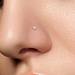 Load image into Gallery viewer, Tiny CZ Nose Bone in 316L Surgical Steel, 20 gauge on model, by Studio Blue on Etsy