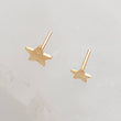 Load image into Gallery viewer, Solid 14K Gold Star studs, overhead shot of the 3mm and 4mm top post side by side on white background by Studio Blue on Etsy