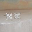 Load image into Gallery viewer, Dainty stud earrings with 4 tiny round diamond CZs bead set in Sterling Silver