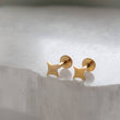 Load image into Gallery viewer, Four-point starburst design in a screw-in style flat back design. 16 Gauge Surgical Steel or 14K Gold plated earrings studs by Studio Blue on Etsy