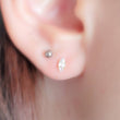Load image into Gallery viewer, Tiny prong set marquise CZ studs in Gold Vermeil, on model by Studio Blue on Etsy