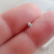 Load image into Gallery viewer, Screw in flat back stud in 316L surgical steel prong set with tiny marquise-shaped diamond cz between 2 fingers by Studio Blue on Etsy