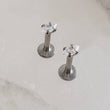 Load image into Gallery viewer, Screw in flat back studs in 316L surgical steel prong set with tiny marquise-shaped diamond cz by Studio Blue on Etsy