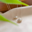 Load image into Gallery viewer, Modern Floating Bead Necklace • Single Sterling Silver Bead • Minimal Style • Layering Necklace • Oval Silver Bead • Gift For Her