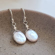Load image into Gallery viewer, Dainty Coin Pearl Earrings • Delicate Pearl Drops • Oval Coin Pearl Earrings • White Freshwater Pearls • Bridesmaid Gift