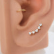 Load image into Gallery viewer, Diamond CZ Ear climber featuring 5 stones, made from implant grade titanium, 14k gold plated. Screw in flat back style for cartilage or lobe by Studio Blue on Etsy