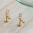 Load image into Gallery viewer, Diamond CZ Ear climber featuring 5 stones, made from implant grade titanium, 14k gold plated. Screw in flat back style for cartilage or lobe by Studio Blue on Etsy
