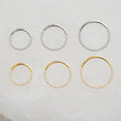 Load image into Gallery viewer, Micro pavé clicker hoop in 316L Surgical Steel or 14k Gold Plate. 18 gauge, front-facing conch, tragus or septum hoop available in 3 sizes by Studio Blue on Etsy