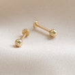 Load image into Gallery viewer, Pair of Solid 14K Yellow Gold Ball studs. Flat back, push-in style. 18 gauge Labret. Monroe, cartilage, 4mm ball, by Studio Blue on Etsy