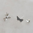 Load image into Gallery viewer, Pair of Sterling silver Butterfly studs earrings shown on white background by Studio Blue on Etsy