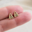 Load image into Gallery viewer, Bronze Ouija Board-inspired stud earrings between two fingers. Yes & No, Moon & Star. By Studio Blue on Etsy
