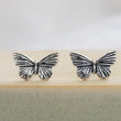 Load image into Gallery viewer, Pair of Sterling silver Butterfly studs earrings shown on a sage green and tan ceramic dish, by Studio Blue on Etsy