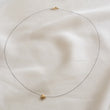 Load image into Gallery viewer, Golden Pyrite Star necklace on black filament, shown on white background by Studio Blue on Etsy
