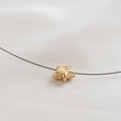Load image into Gallery viewer, Golden Pyrite Star necklace on black filament, shown on white background by Studio Blue on Etsy