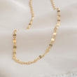 Load image into Gallery viewer, Dainty shimmer chain in 14k gold fill on beige material by Studio Blue on Etsy