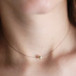 Load image into Gallery viewer, Golden Pyrite Star necklace on black filament, shown on model background by Studio Blue on Etsy