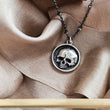 Load image into Gallery viewer, Sterling silver Skull medallion with an oxidized, dotted silver chain, on brown ribbon. By Studio Blue on Etsy