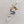 Load image into Gallery viewer, Back view of the Snake &amp; Dagger Necklace pendant showing the black outline
