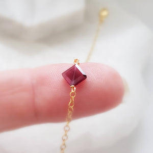 Dainty square cut Garnet bracelet on 14k gold fill cable chain on white background by Studio Blue on Etsy