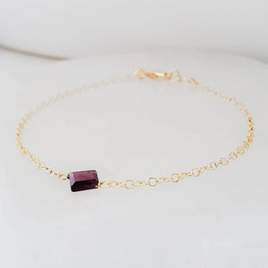 Dainty square cut Garnet bracelet on 14k gold fill cable chain on white background by Studio Blue on Etsy