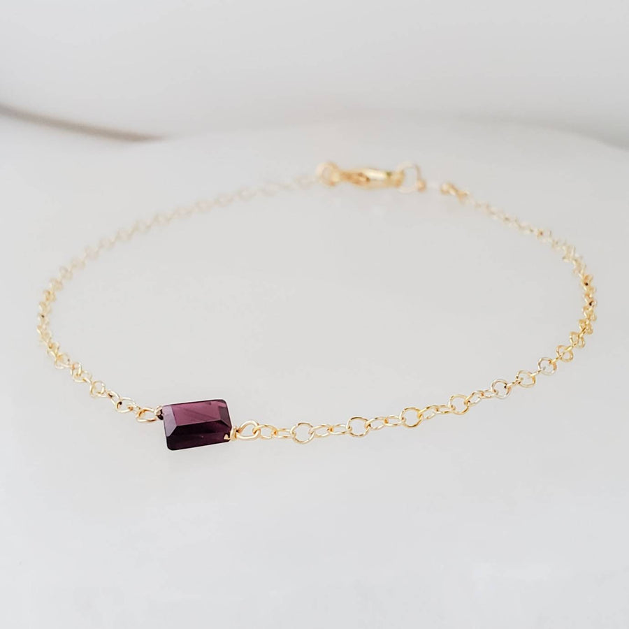 Dainty square cut Garnet bracelet on 14k gold fill cable chain on white background by Studio Blue on Etsy