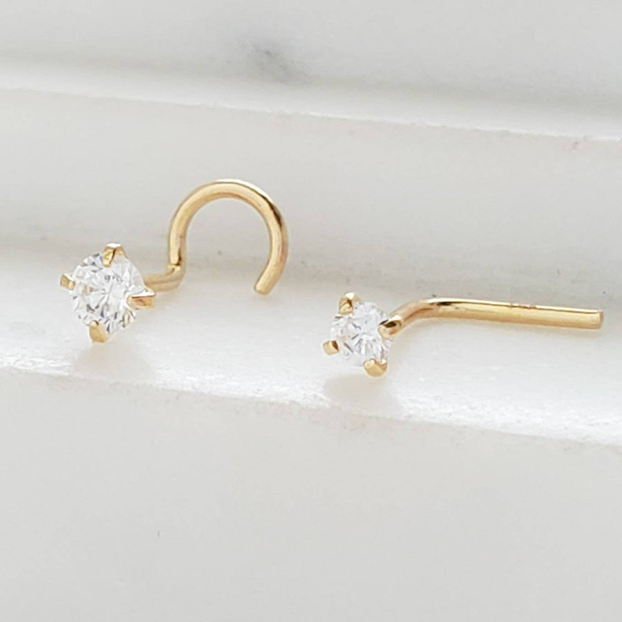 14K Gold and Diamond CZ nose stud shown in screw or L-Bend style, 22 gauge, on a white background by Studio Blue on Etsy