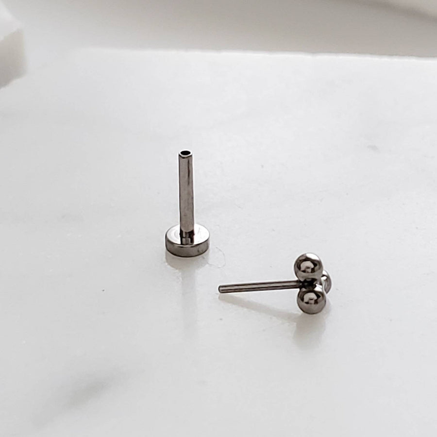 Tiny 3 bead titanium push in flat back stud shown on white background by Studio Blue on Etsy