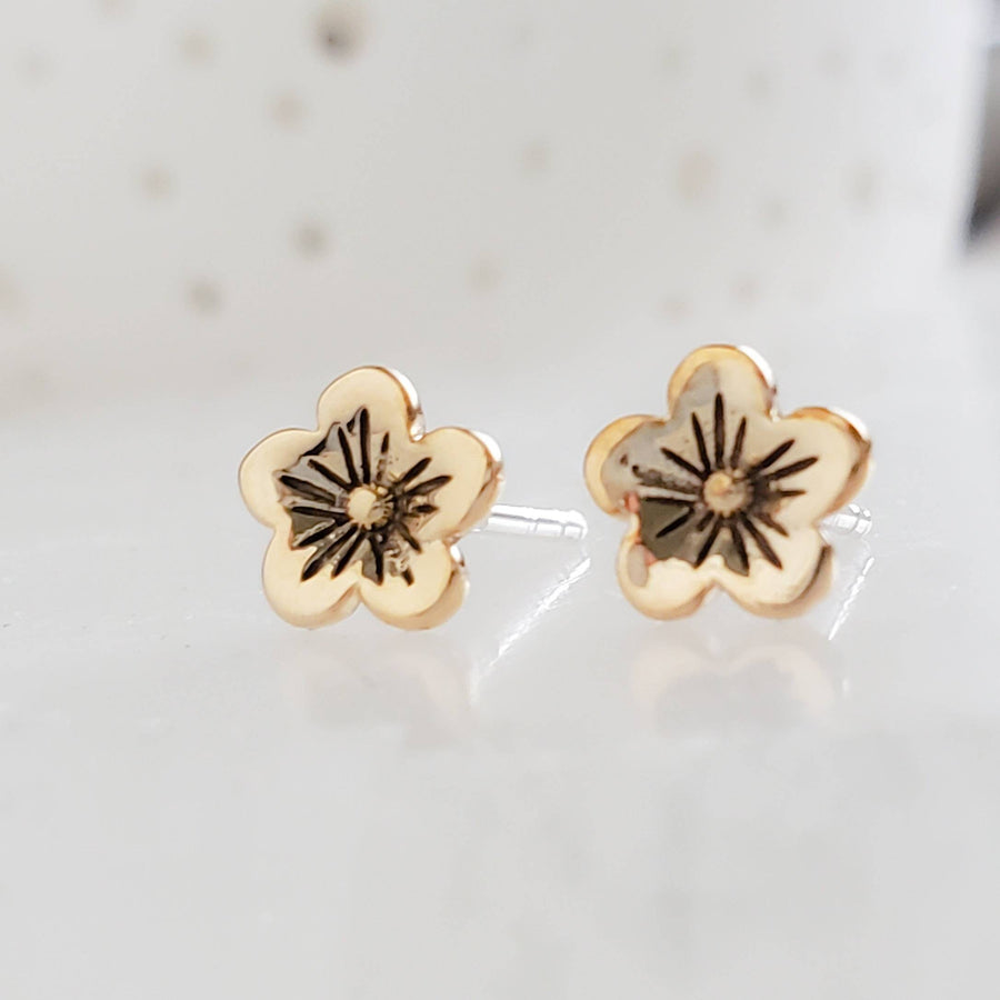 Bronze Cherry Blossom Studs with Sterling Silver posts on a white background, by Studio Blue on Etsy