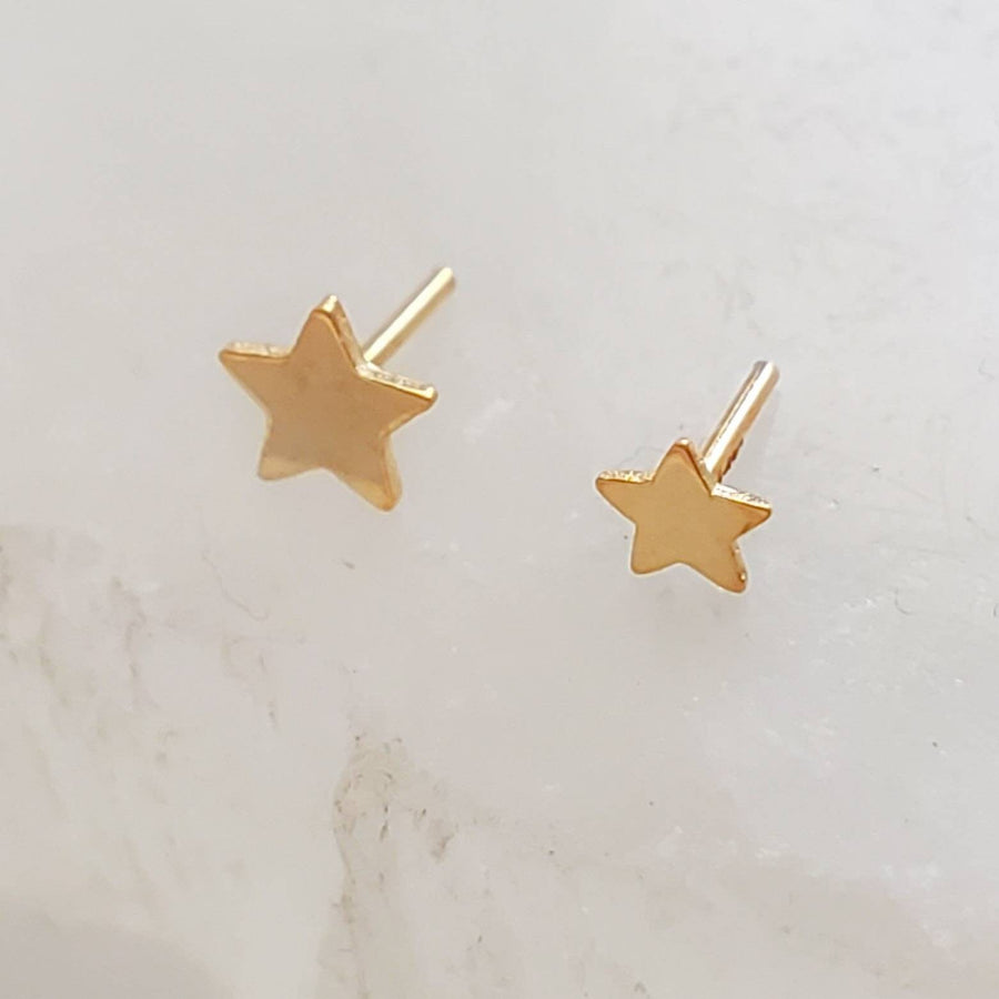 Solid 14K Gold Star studs, overhead shot of the 3mm and 4mm side by side on white background by Studio Blue on Etsy