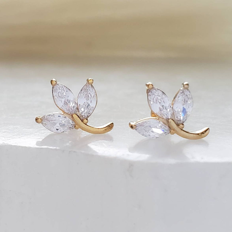 Pair of 3 leaf vine stud in diamond cz, 14k gold plated surgical steel on white background by Studio Blue on Etsy