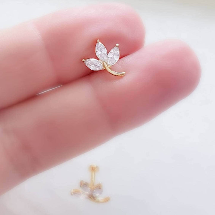 3 leaf vine stud in diamond cz, 14k gold plated surgical steel between 2 fingers by Studio Blue on Etsy