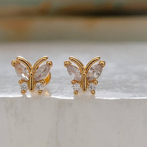 Diamond CZ Butterfly studs in 14k gold plated 316L Surgical steel shown on white background. Screw-in, flat-back nap studs by Studio Blue on Etsy