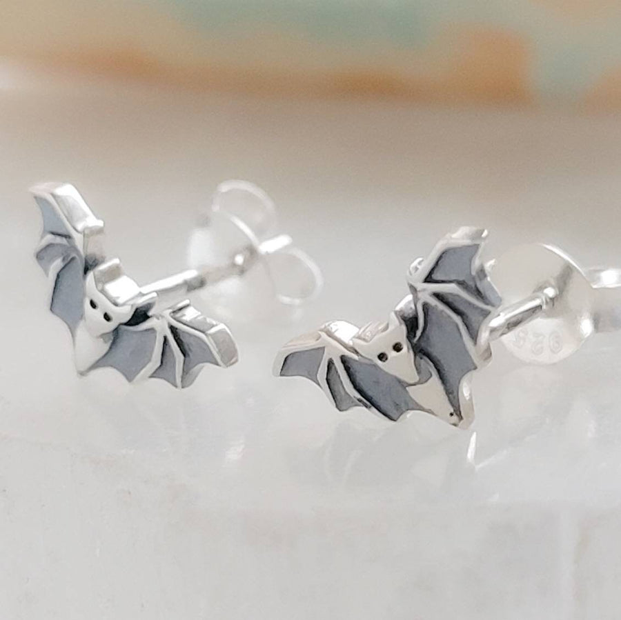 Sterling silver little bat studs on white background by Studio Blue on Etsy