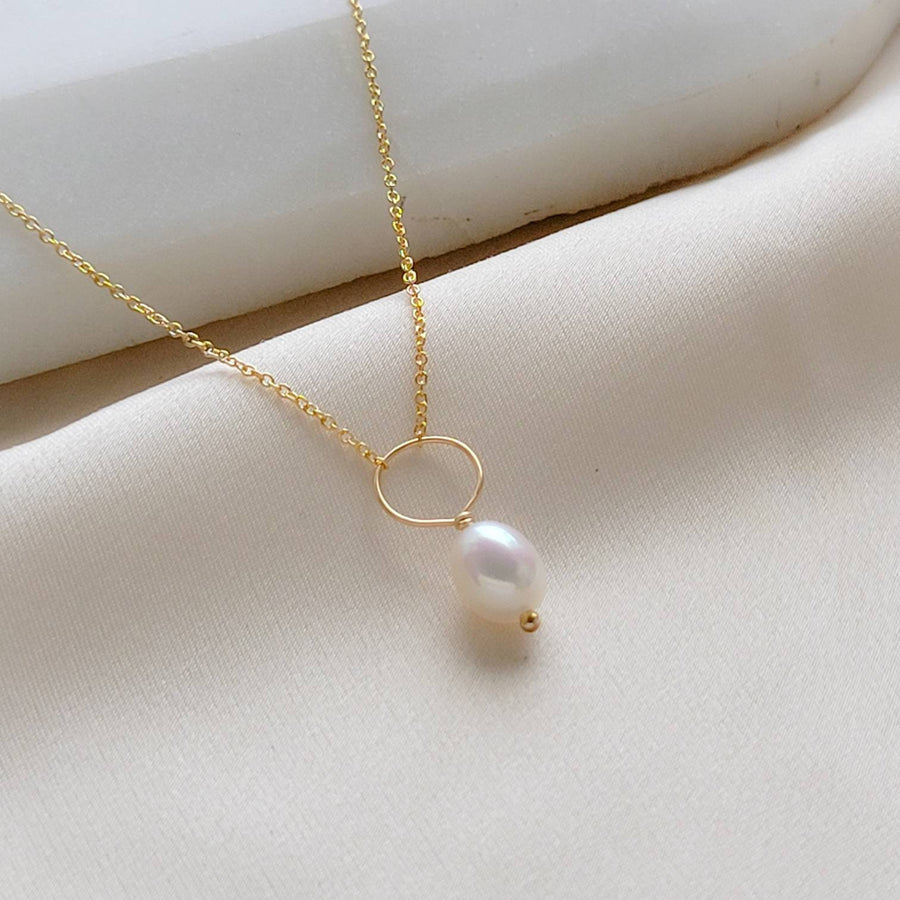 Oval freshwater pearl on oversized loop and delicate chain. Bridal Jewelry by Studio Blue