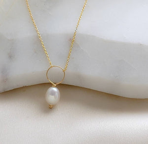 Oval freshwater pearl on oversized loop and delicate chain. Bridal Jewelry by Studio Blue