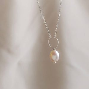 Oval freshwater pearl on oversized loop and delicate chain. Bridal Jewelry by Studio Blue