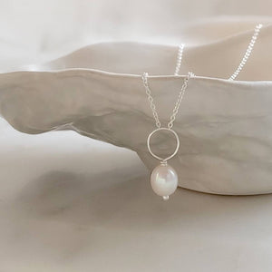 Oval freshwater pearl on oversized loop and delicate chain. Bridal Jewelry by Studio Blue