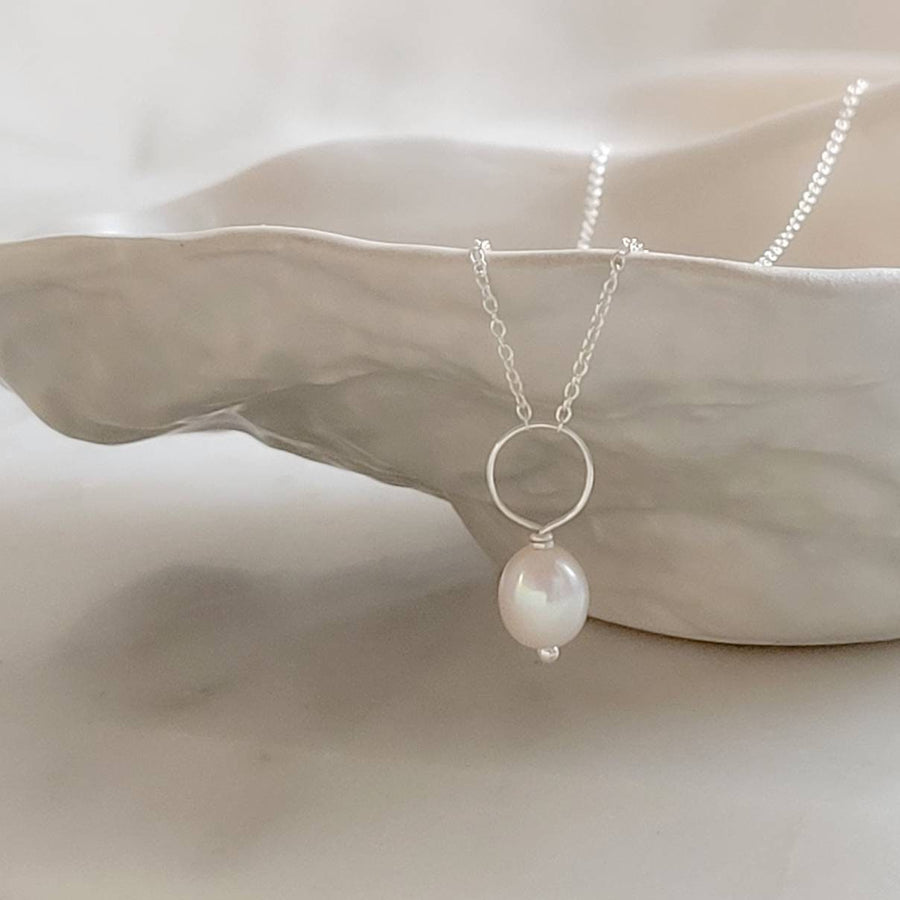 Oval freshwater pearl on oversized loop and delicate chain. Bridal Jewelry by Studio Blue