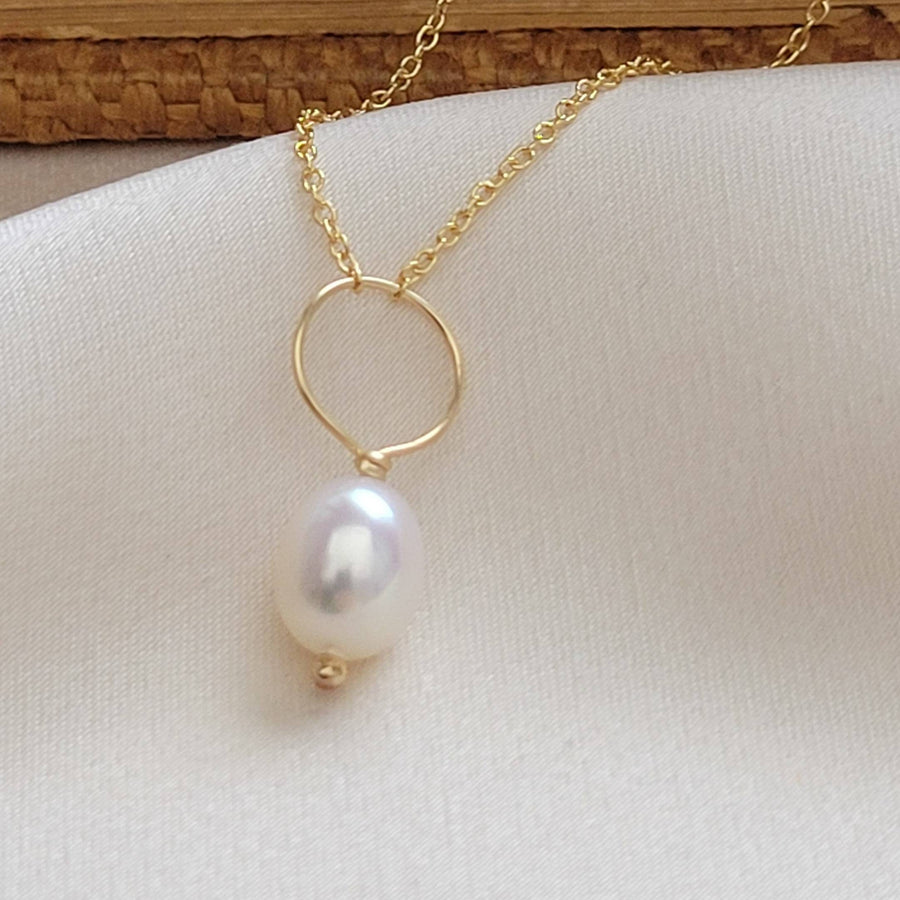 Oval freshwater pearl on oversized loop and delicate chain. Bridal Jewelry by Studio Blue