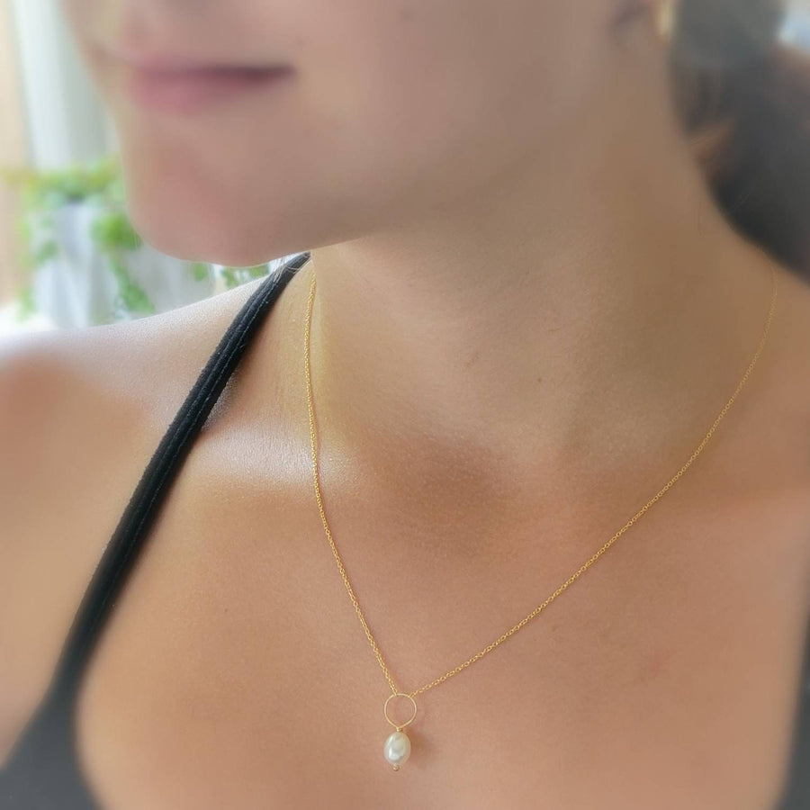 Oval freshwater pearl on oversized loop and delicate chain. Bridal Jewelry by Studio Blue