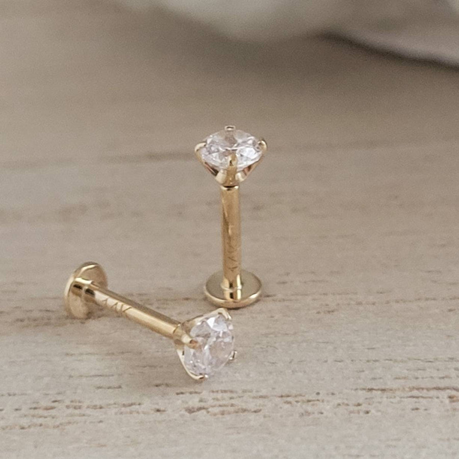 Pair of 14 karat gold and Diamond CZ push in style flat back studs.