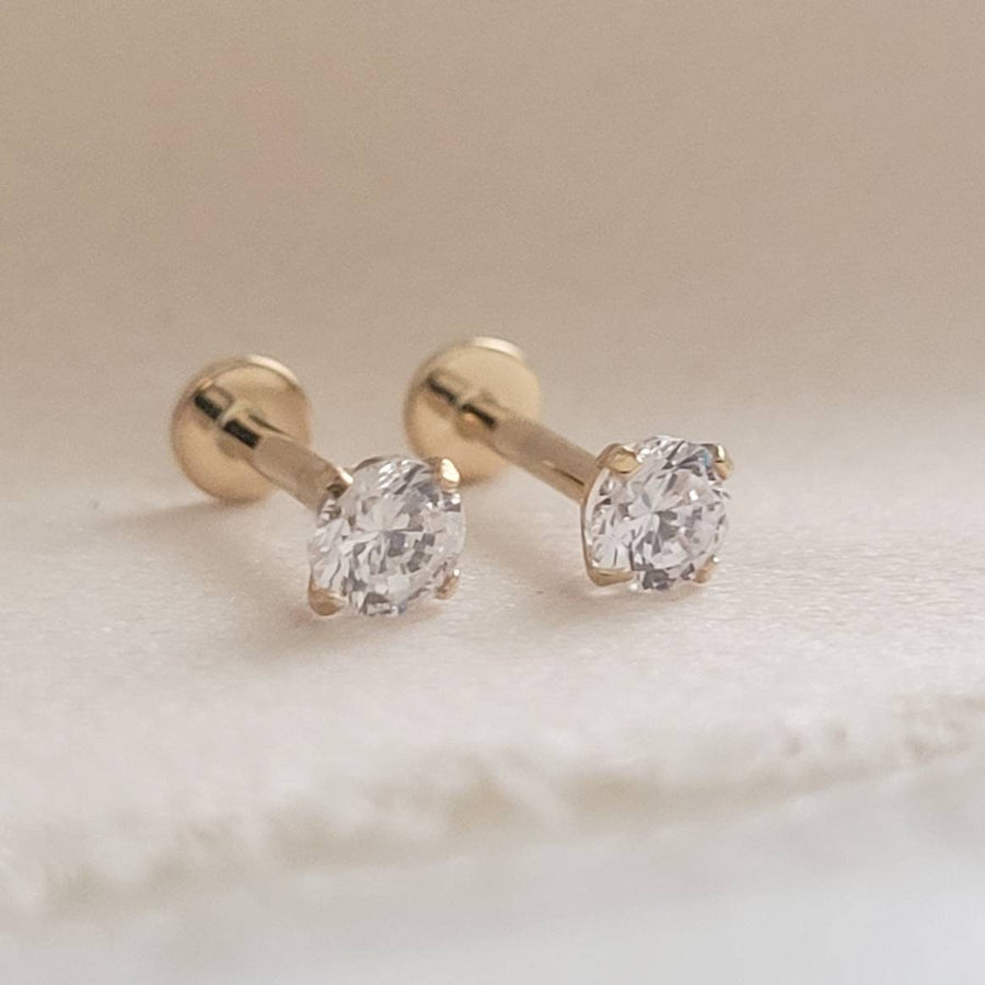 Pair of 14 karat gold and Diamond CZ push in style flat back studs.