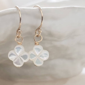 Hand carved mother of pearl 4 leaf clover drop earrings in 14k gold fill. - By Studio Blue