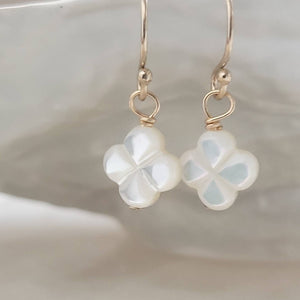 Hand carved mother of pearl 4 leaf clover drop earrings in 14k gold fill. - By Studio Blue